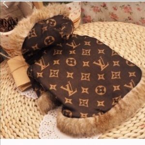 2 Dog clothes. One brown and one jeans.